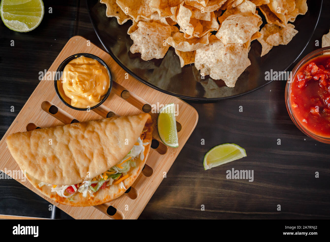 Homemade Baja Fish Tacos with Mango Salsa and Chips. Mixed mexican food ...