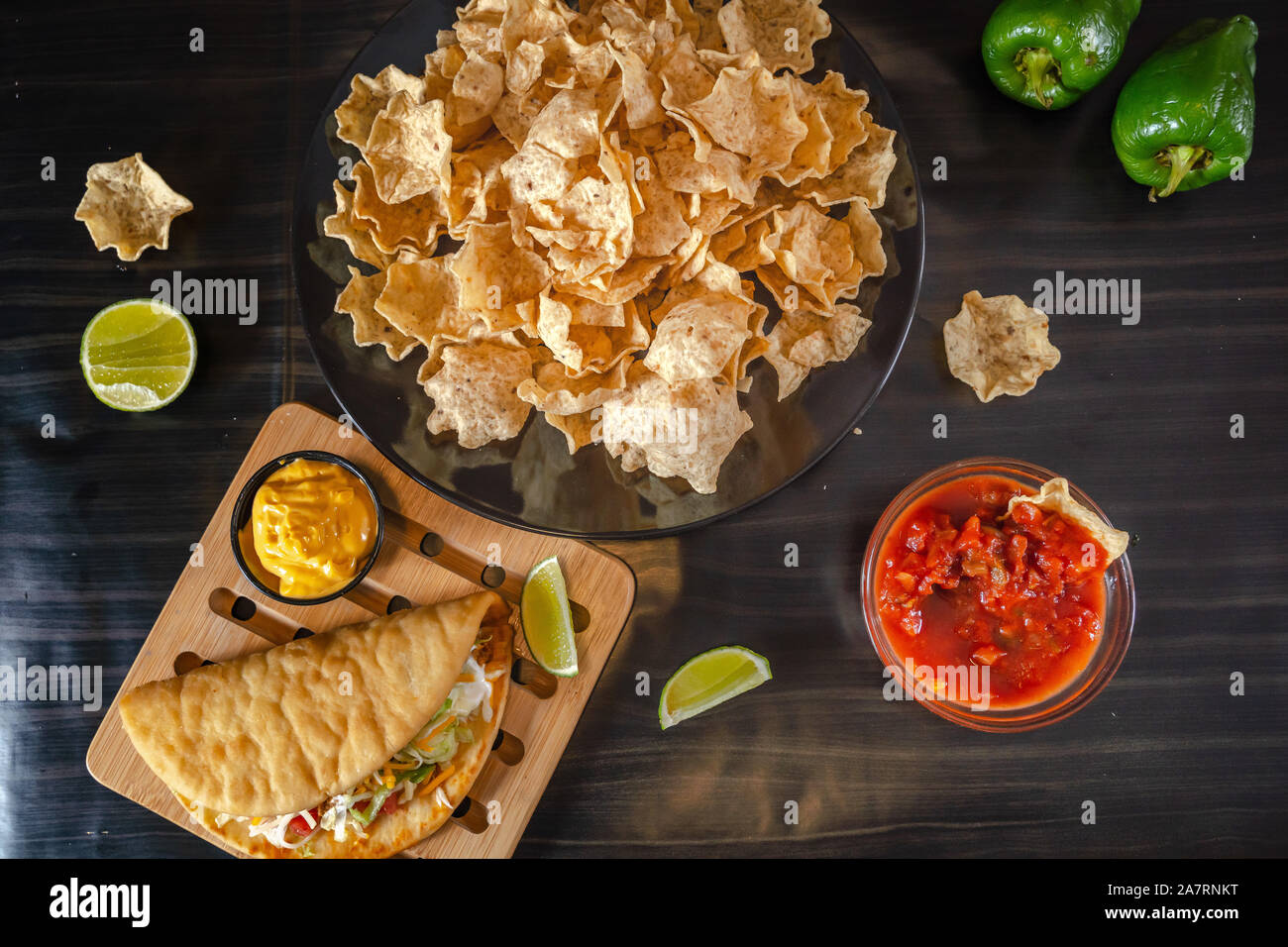 Homemade Baja Fish Tacos with Mango Salsa and Chips. Mixed mexican food