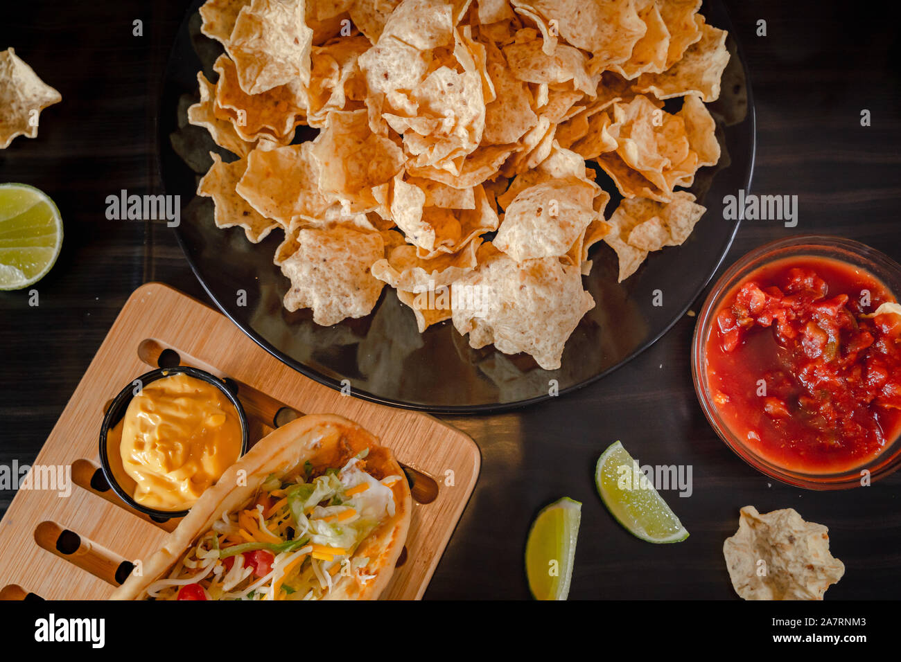 Homemade Baja Fish Tacos with Mango Salsa and Chips. Mixed mexican food ...
