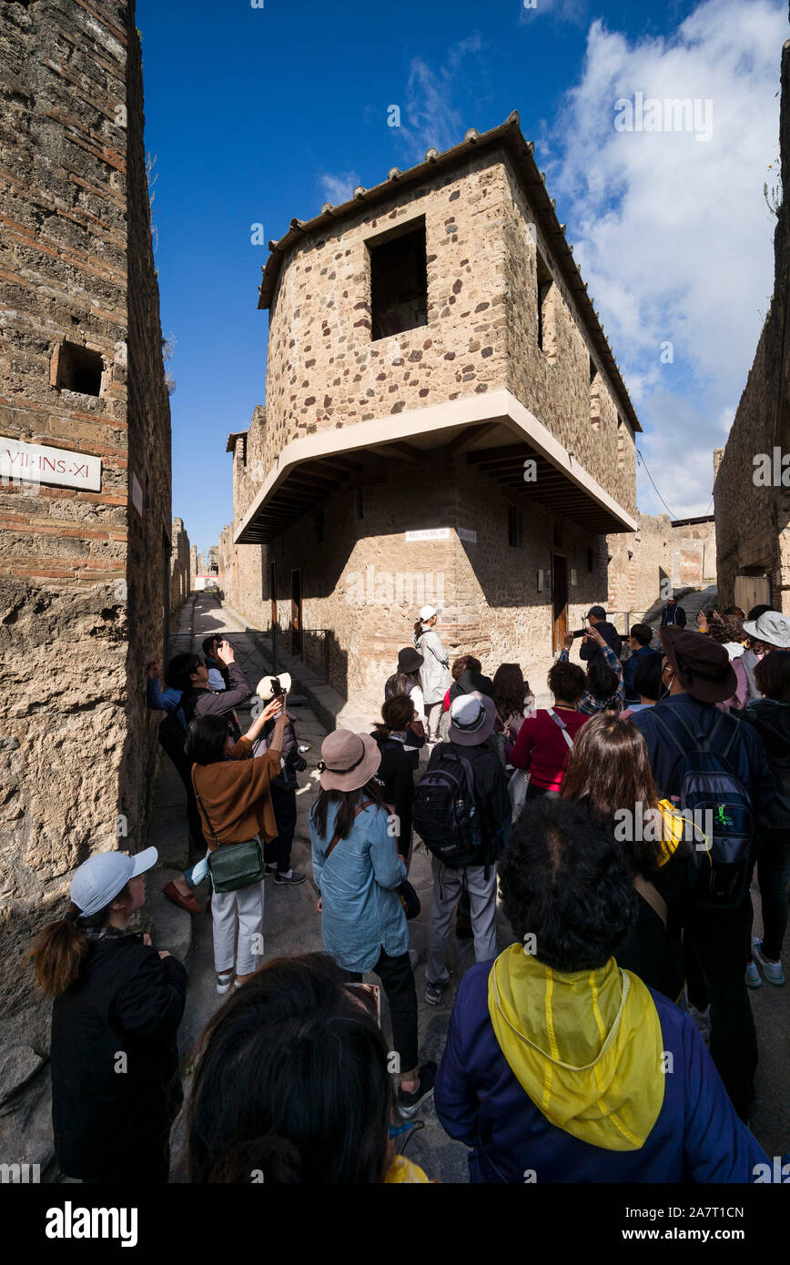 Pompei. Italy. Archaeological site of Pompeii. The Lupanar (Brothel), 1st century AD, attracts large numbers of tourists.   Regio VII-12-18 Stock Photo
