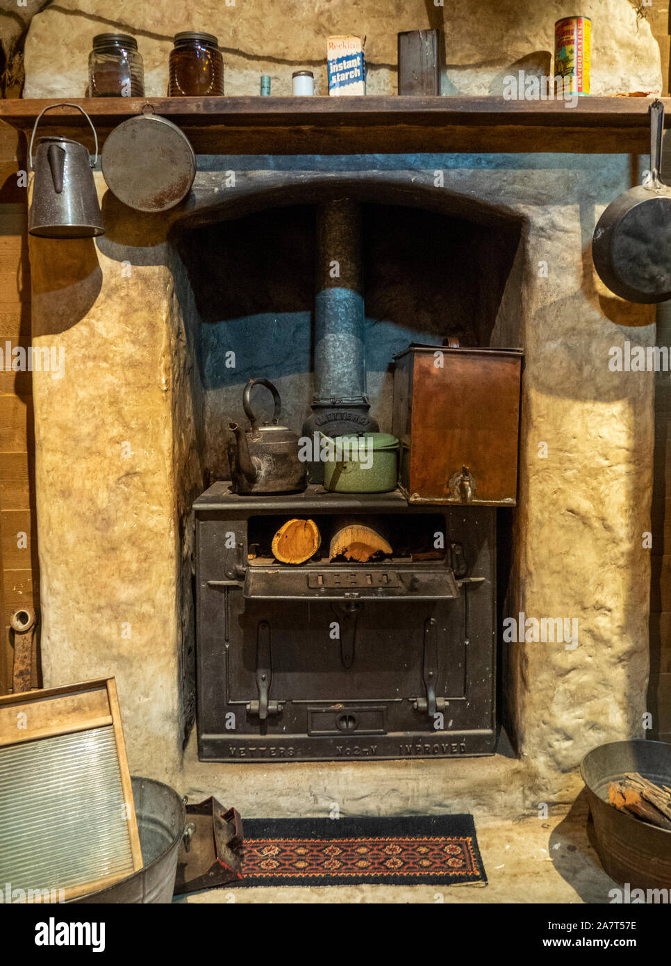 Display Of Wood Fired Stove Fireplace And Kitchen Utensils In A