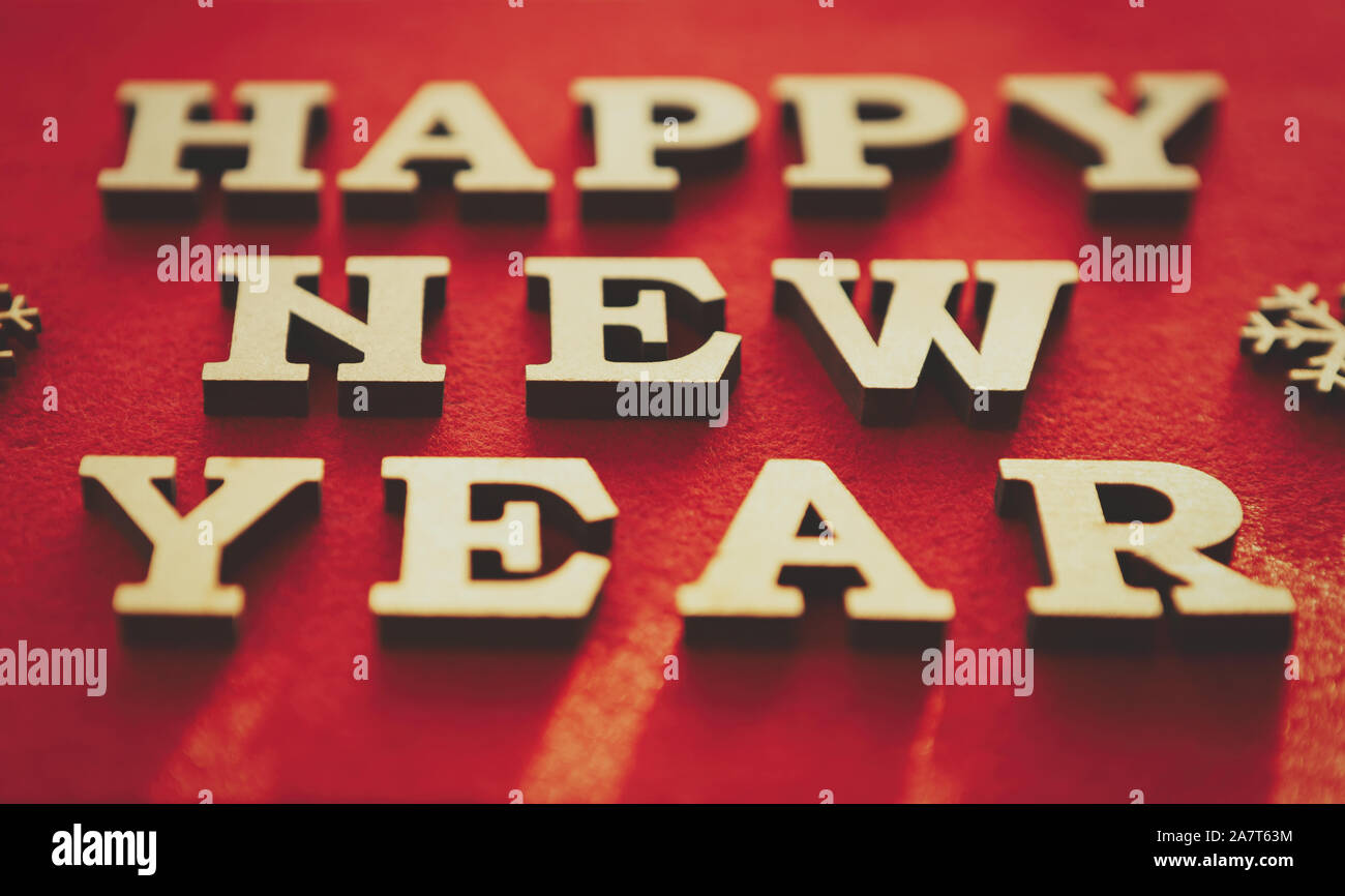 Happy New Year Background Vintage Wooden Letters On Red Backdrop