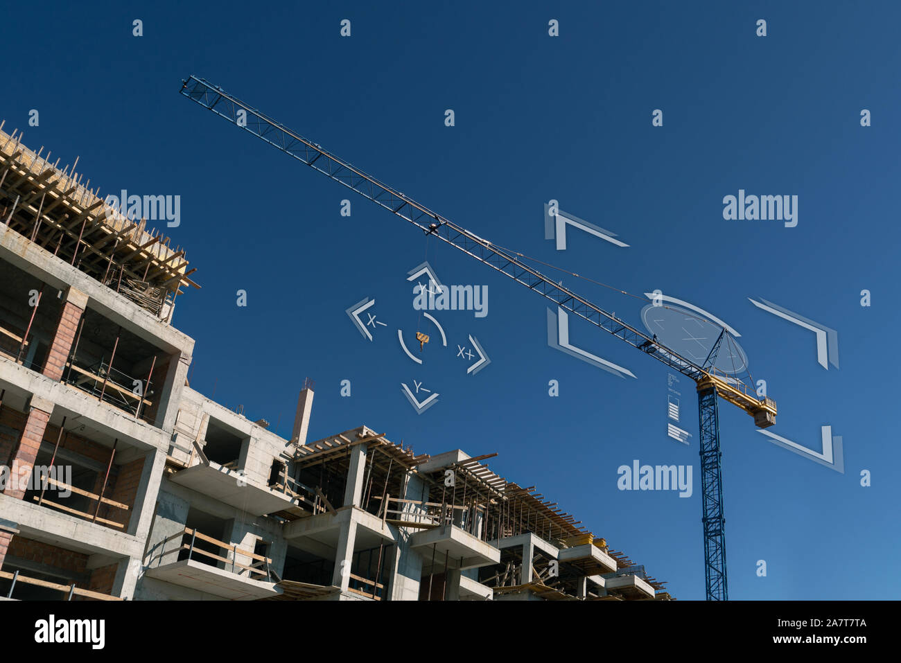Remote-controlled unmanned crane. Digital transformation in construction industry. Stock Photo