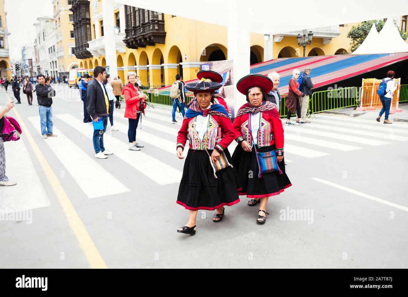 LIMA,PERU- circa OCTOBER, 2019: Peruvian ladies in traditional rural  clothes walking across main square in Lima Stock Photo - Alamy