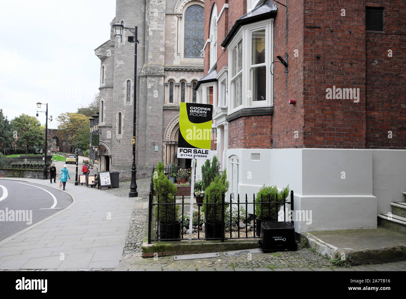 Estate agent property for sale sign outside a house building in Castle