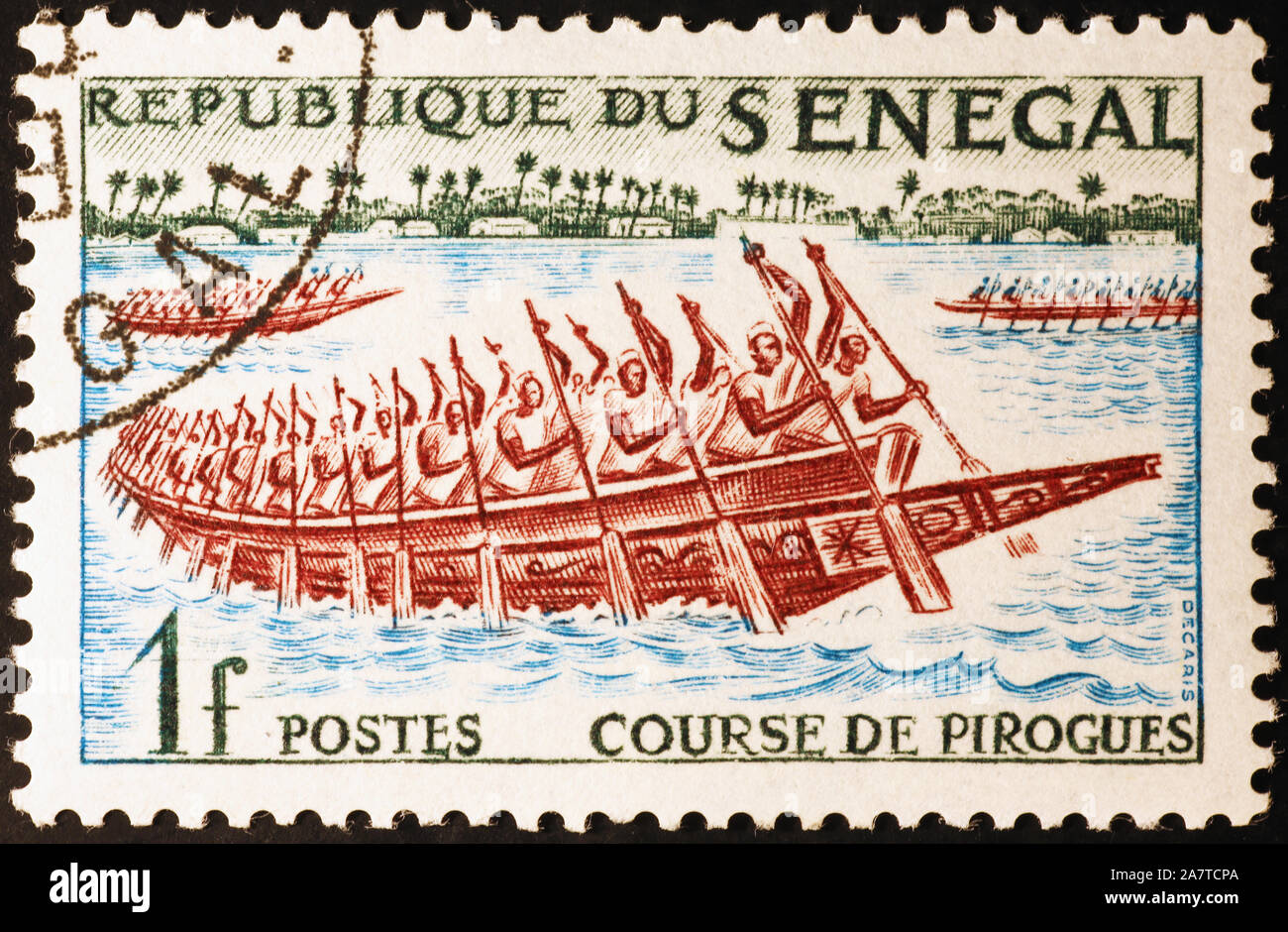 Race of piraguas on postage stamp of Senegal Stock Photo