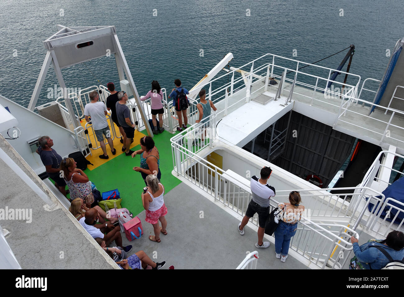 Guernsey 25 July 2019: Foot passengers waiting to disembark from a Condor ferry which is arriving in Guernsey Stock Photo