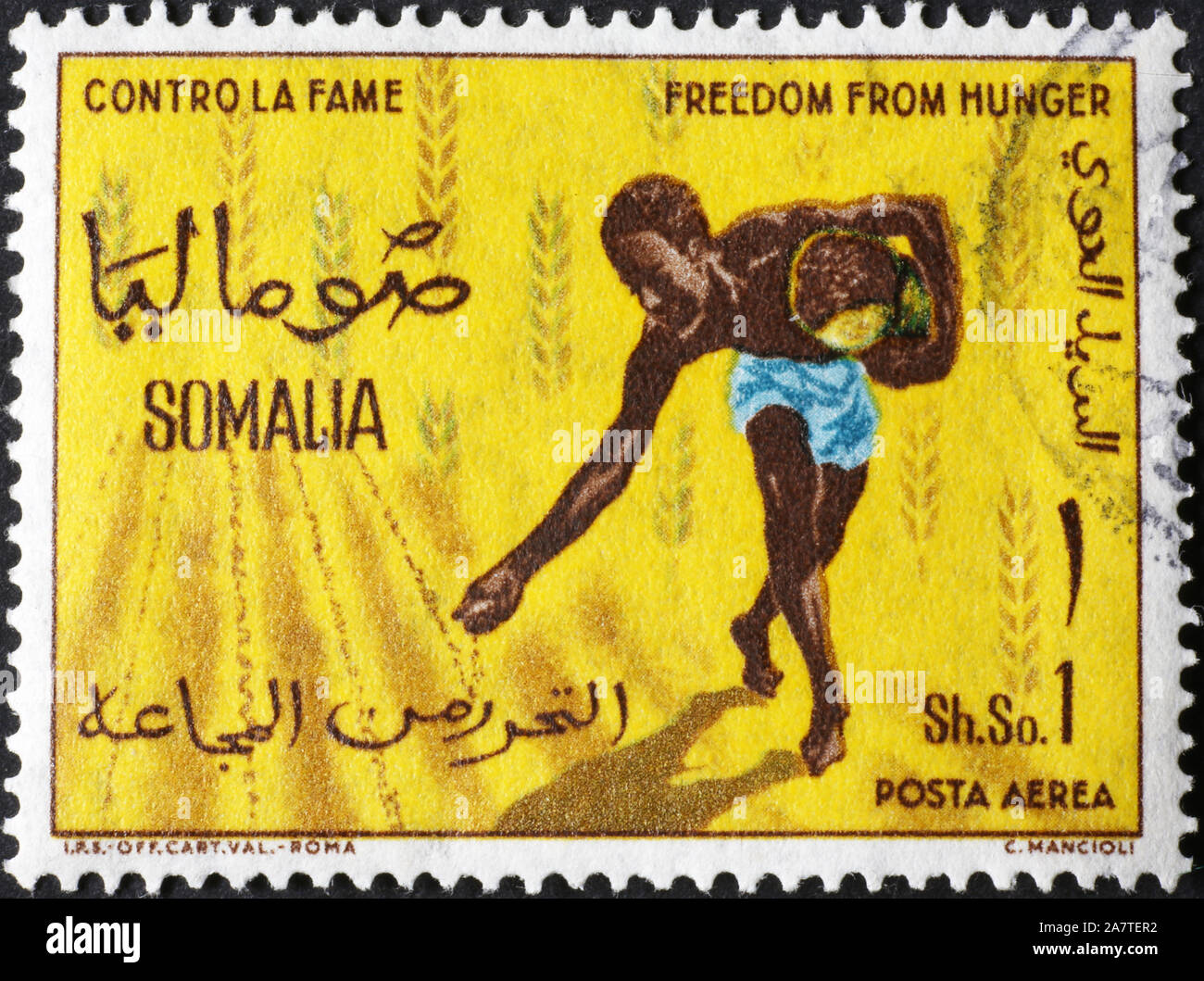 Farmer sowing on somali postage stamp Stock Photo