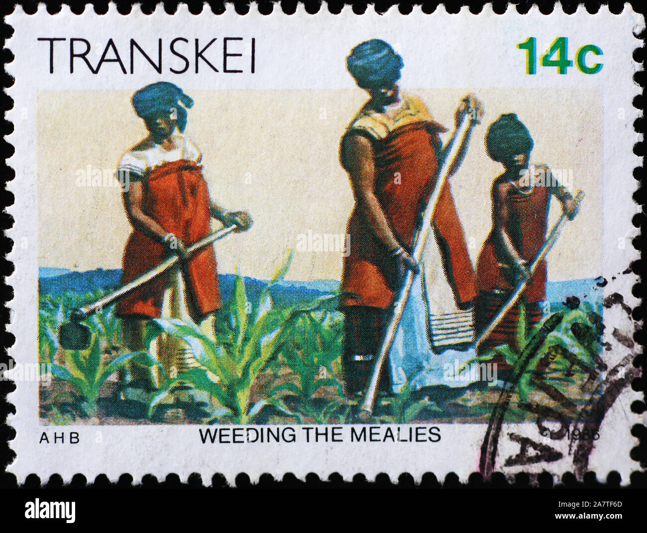 Women weeding a field on south african stamp Stock Photo