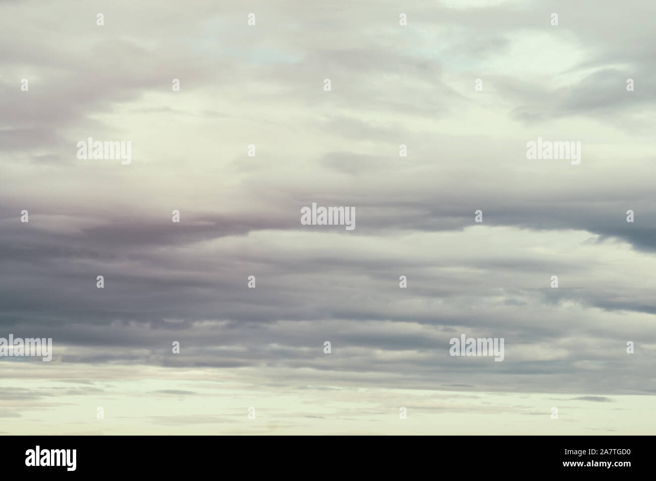 Soft background with stratus clouds. Dramatic cloudscape under cinematic color filter Stock
