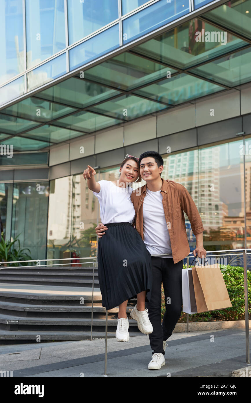 Young happy couple with shopping bags in the city,having fun together Stock Photo