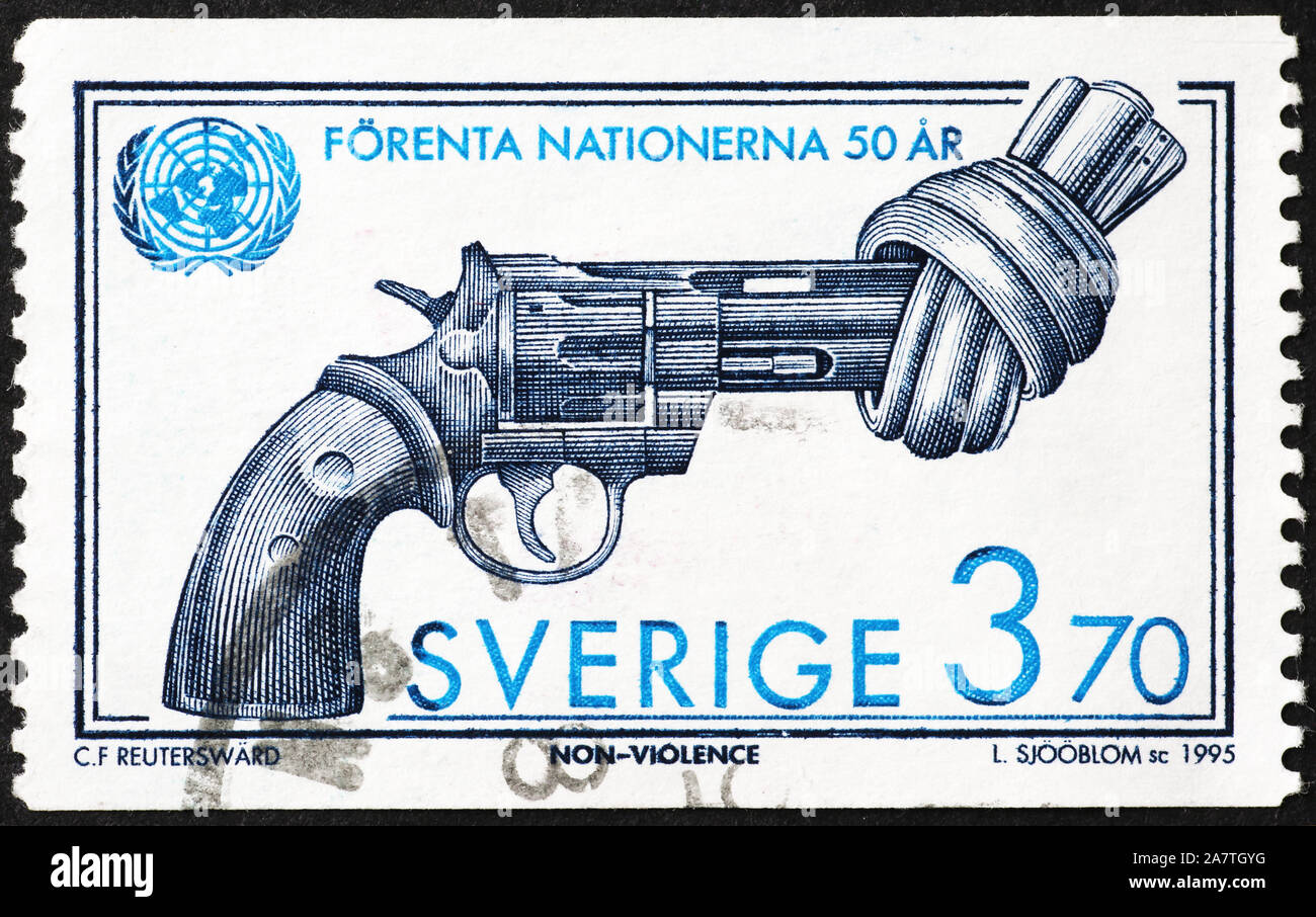 Pistol with a knot on swedish postage stamp Stock Photo