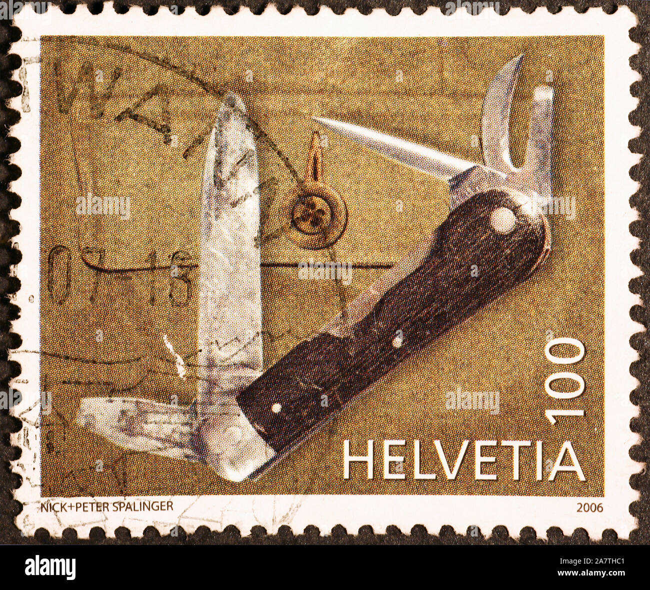 Jackknife on swiss postage stamp Stock Photo