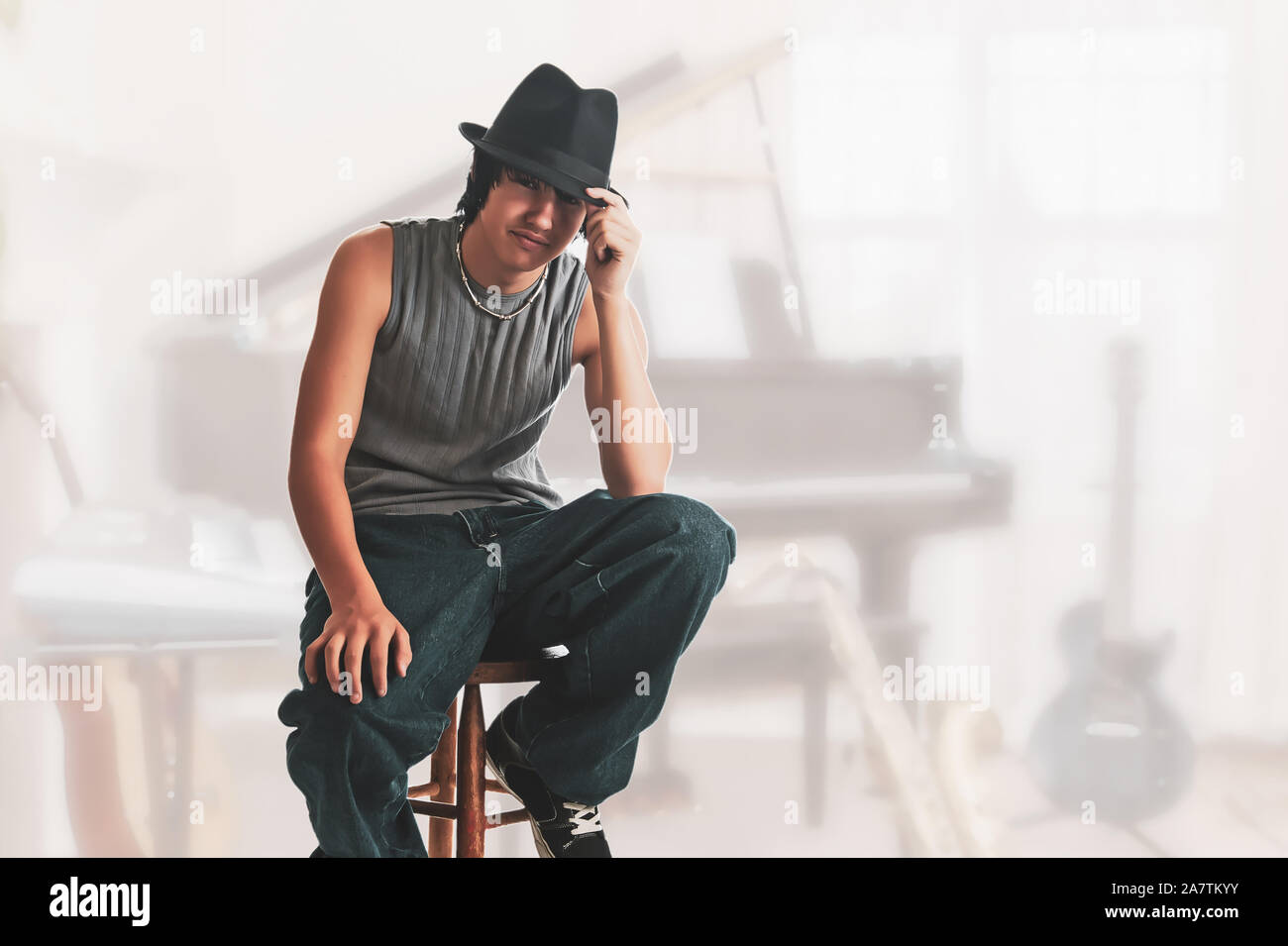 Young Musician Resting between sets on a stool Stock Photo - Alamy