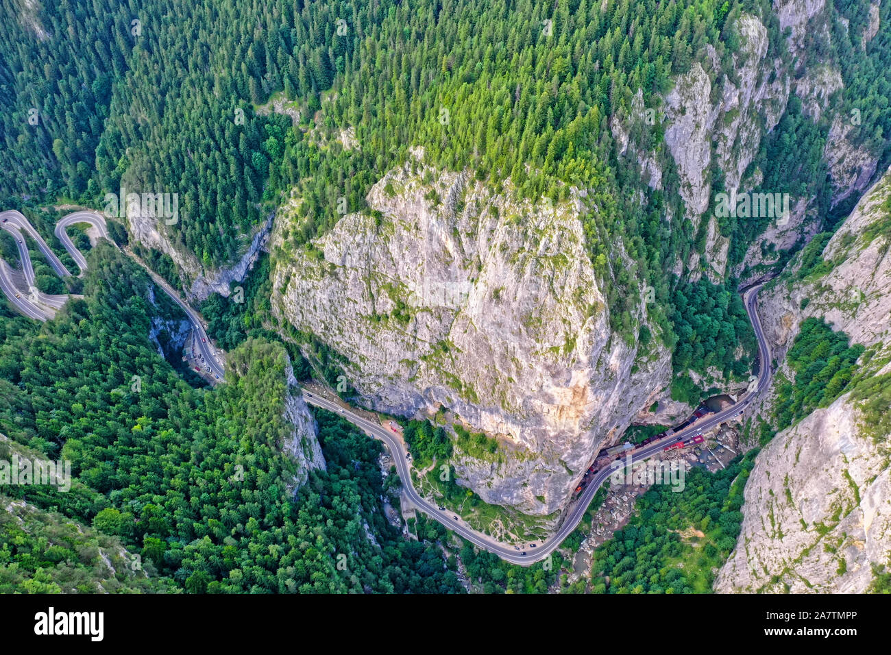 Above view of winding forest road, mountain pass in Romanian Carpathians Stock Photo