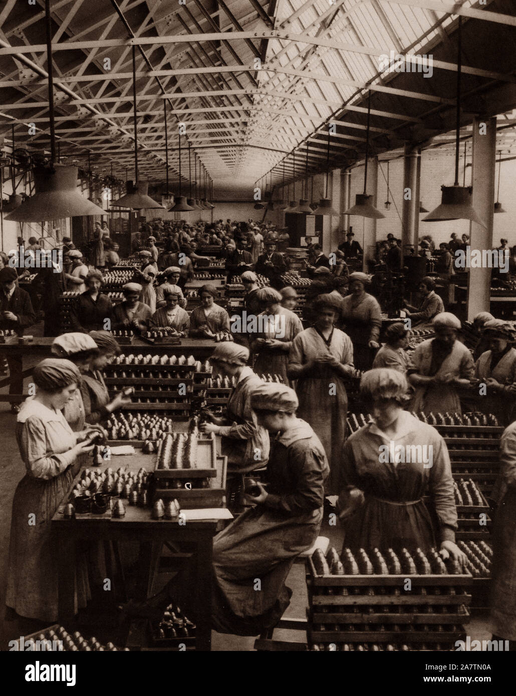 Factory girls packing fuse heads at the Coventry Ordnance Works. The company had been making guns for nine years prior to the war after being set up in 1905 by a consortium of British shipbuilding firms. The workers worked day and night on long shift patterns to create a varied selection of armaments, including guns, gauges, tools and even large naval guns. Stock Photo