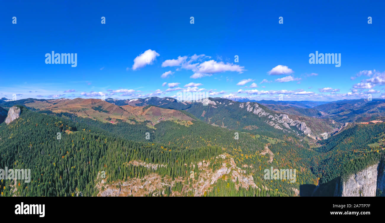 Aerial view of autumn forest and rocky mountain in a beautiful day ...
