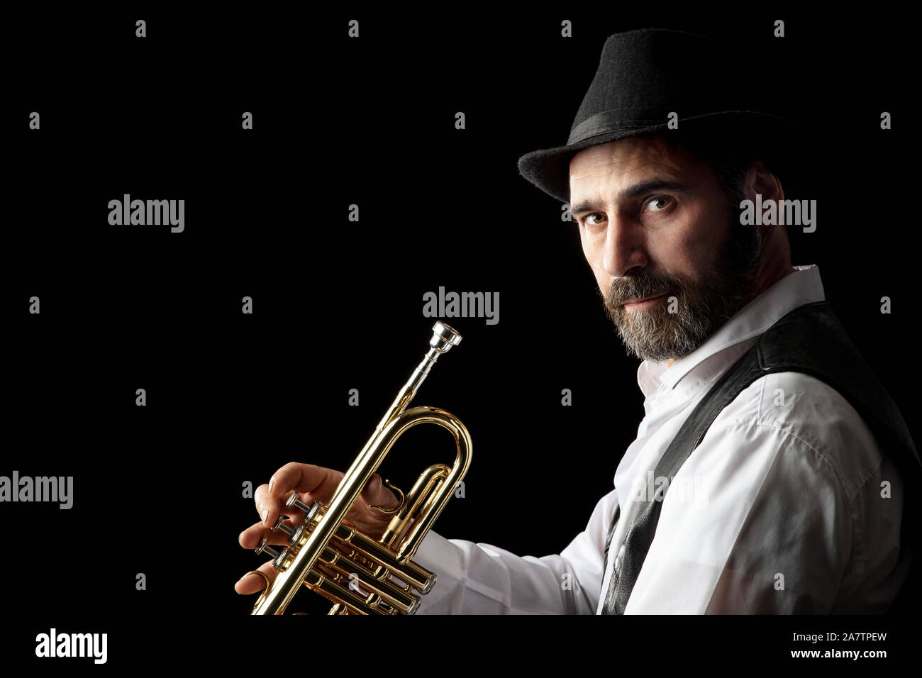 trumpet man with beard portrait on black background Stock Photo