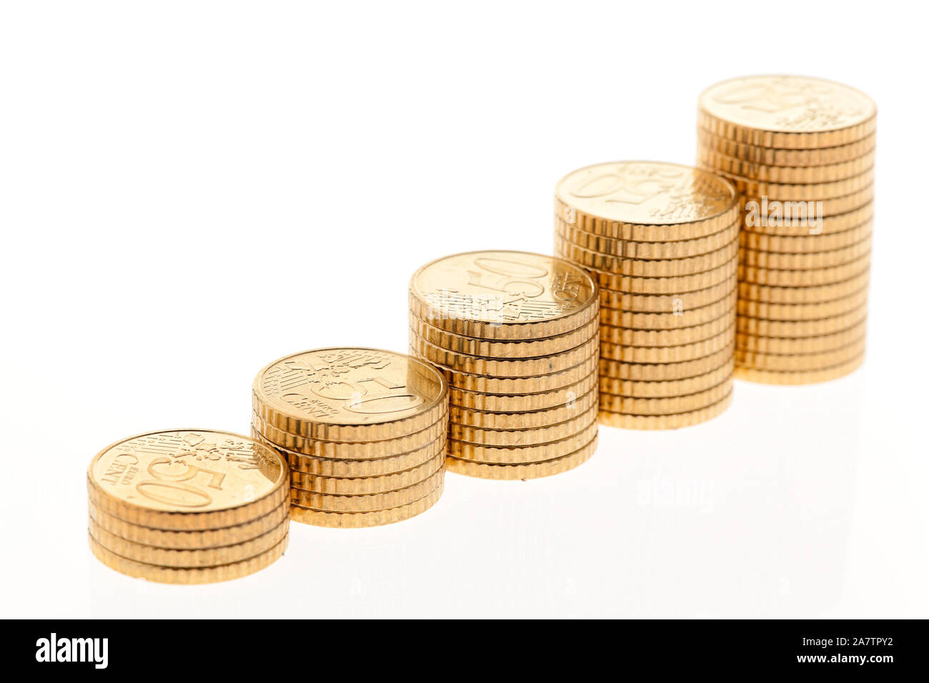 Einige Stapel von Euro Geld Münzen auf weissem Hintergrund, 50 Cent Münzen, Mindesteinkommen,  Notgroschen, Benzingeld, Vorsorge, Sparen, Stock Photo