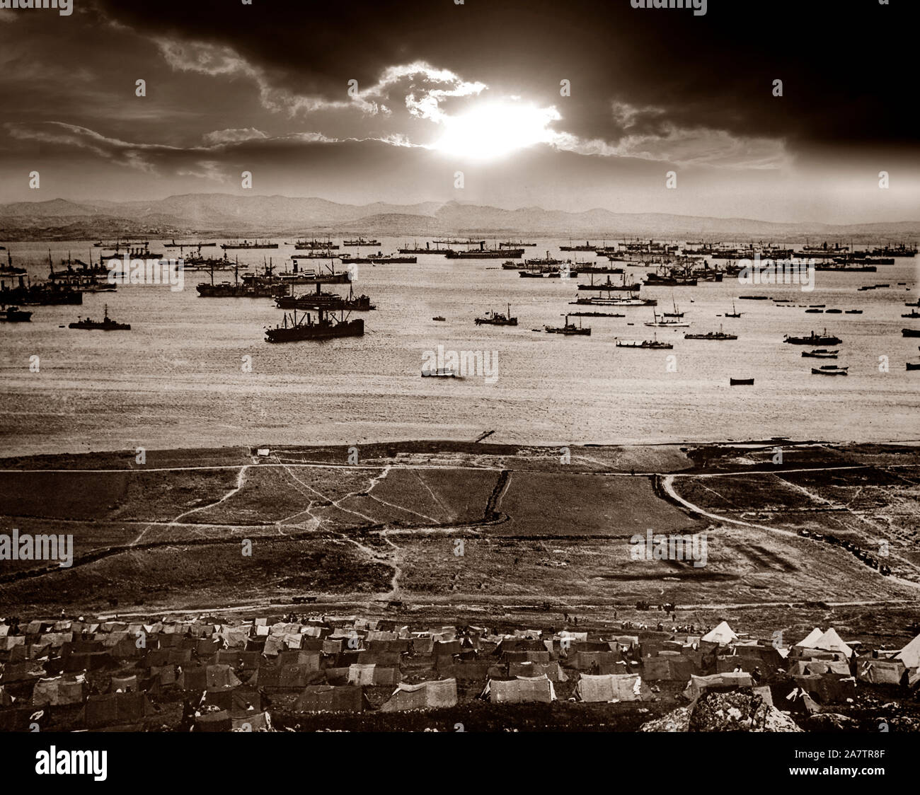 In early 1915, the Allies  used the island of Lemnos in the northern part of the Aegean Sea, to try to capture the Dardanelles Straits, some 50 kilometres (31 miles) away. Massed shipping in the harbour at Moudros was put under the control of British Admiral Rosslyn Wemyss, who was ordered to prepare the then largely unused harbour for operations against the Dardanelles. This was done chiefly by the British and largely through the enthusiasm of Winston Churchill. Stock Photo