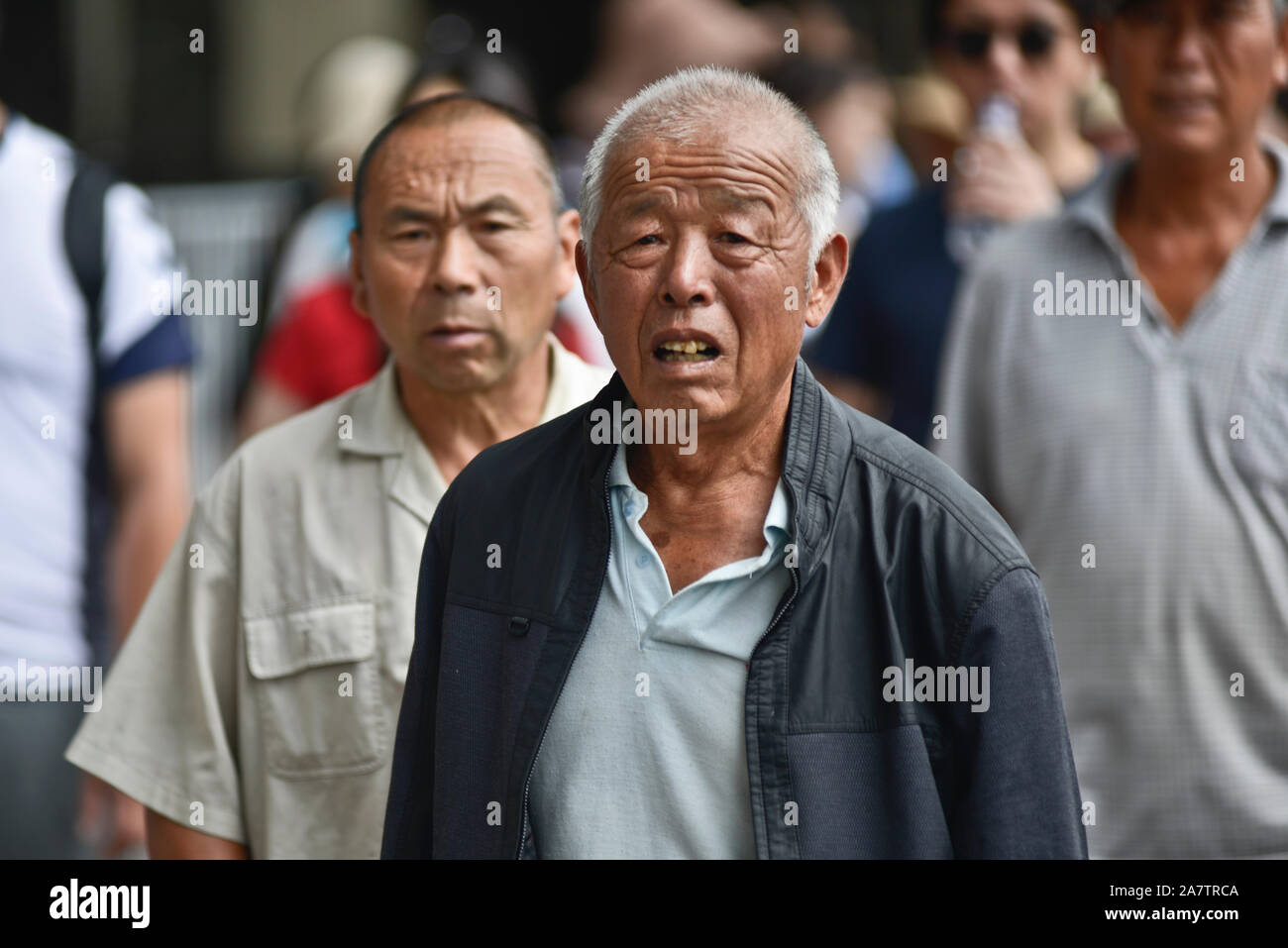 Chinese man in Tiananmen Square, Beijing, China Stock Photo