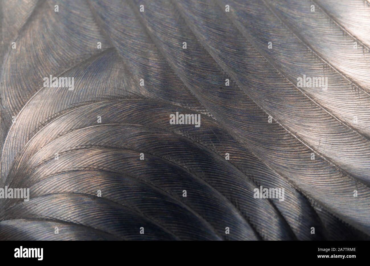 Close-up of industrial realistic gray color stainless steel flat part in partial focus after industrial CNC routing processing with high contrast abst Stock Photo