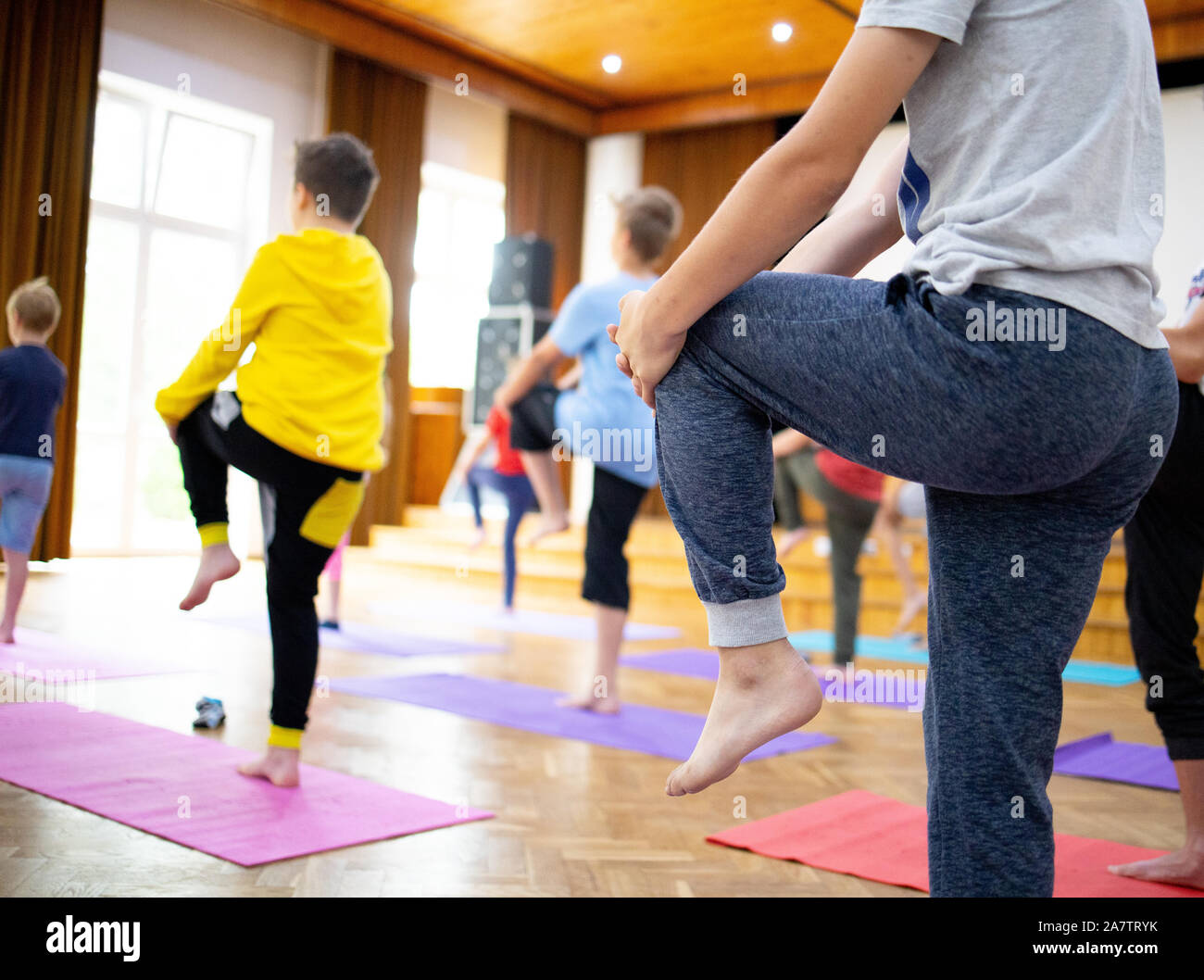 yoga class, yoga training,child , yoga on mats Stock Photo