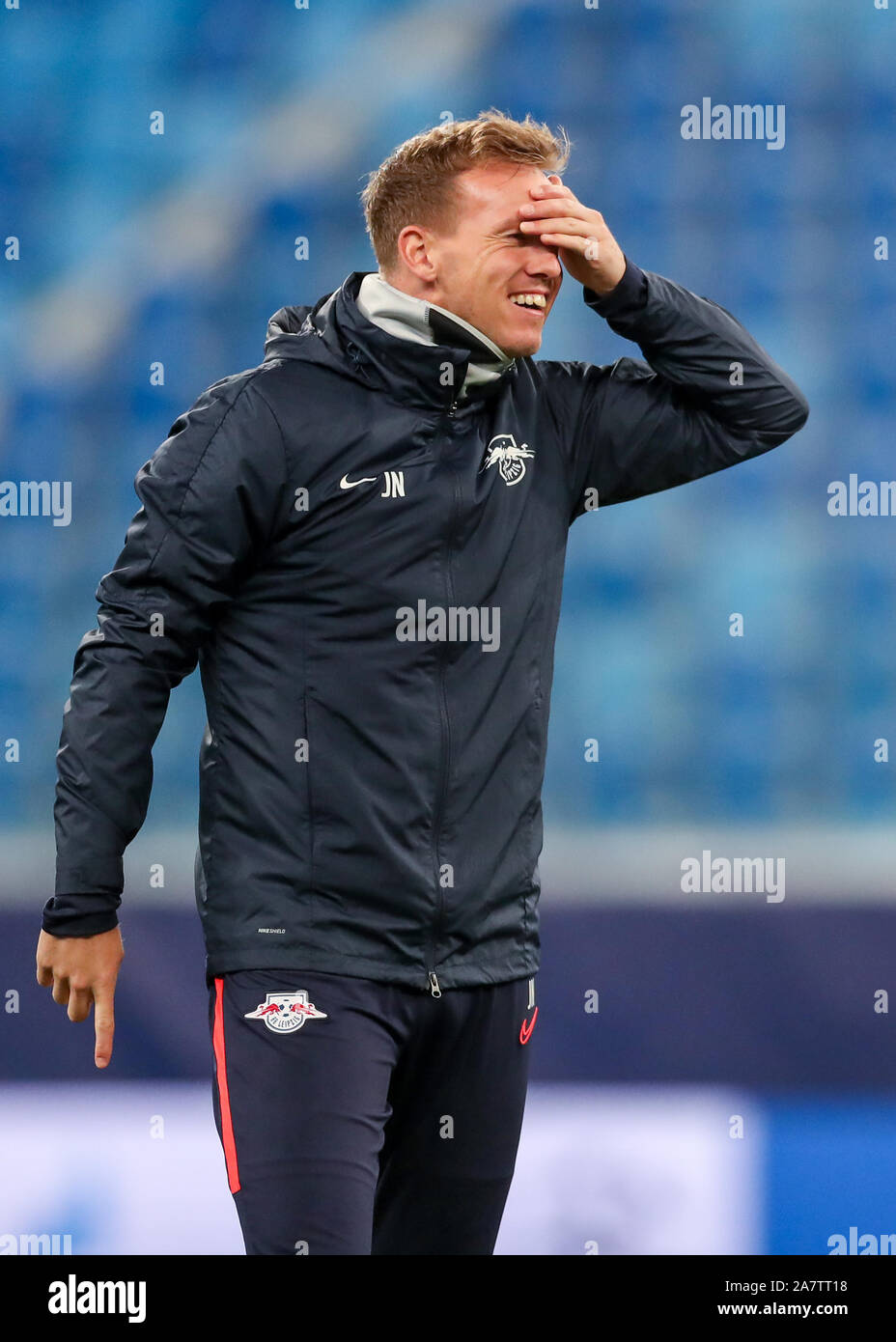 St. Petersburg, Russia. 04th Nov, 2019. Soccer: Before the Champions League game Zenit St. Petersburg - RB Leipzig. Leipzig coach Julian Nagelsmann takes part in the final training and grabs his forehead with a wet ball after a header. Credit: Jan Woitas/dpa-Zentralbild/dpa/Alamy Live News Stock Photo