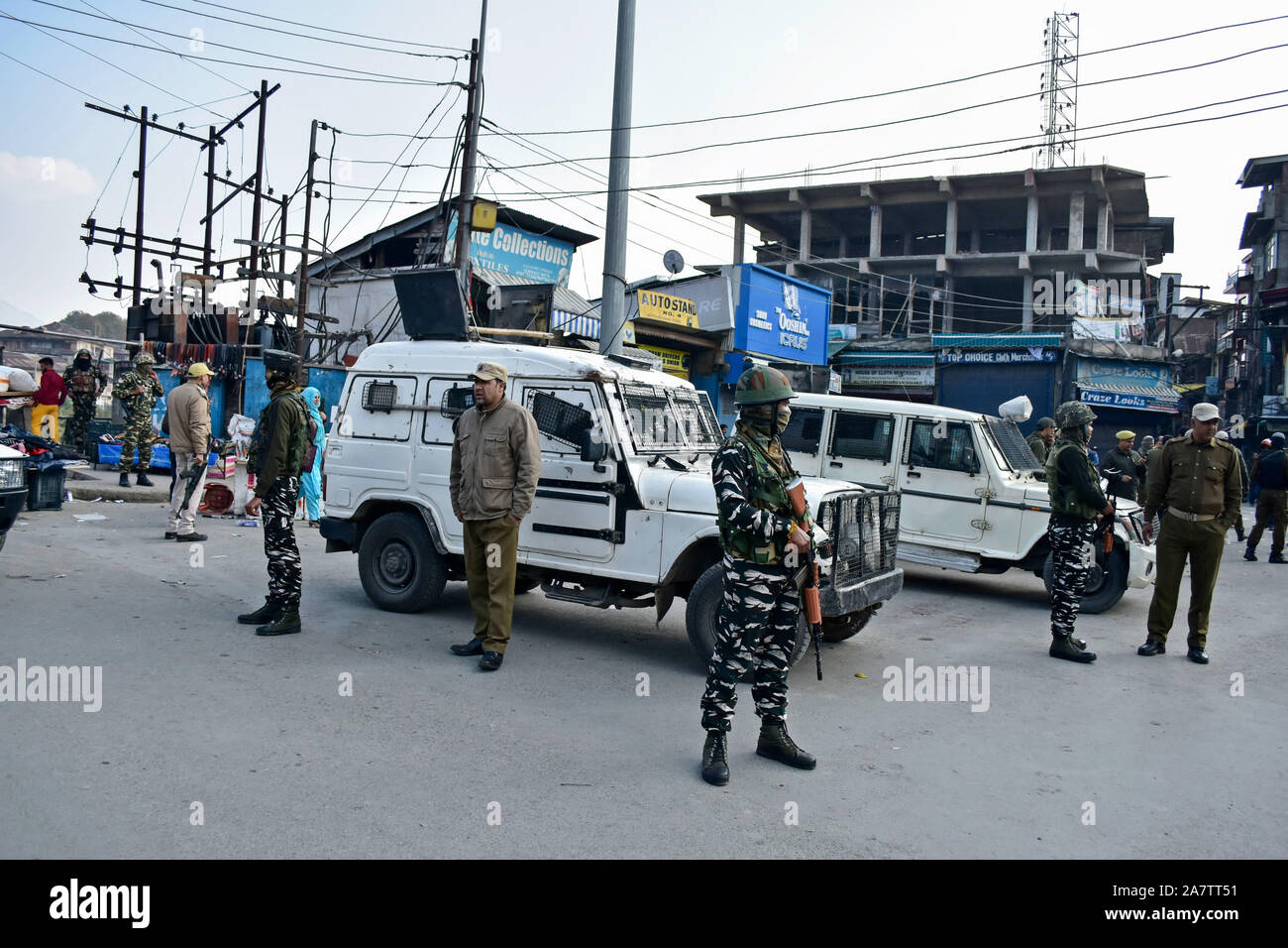 Paramilitary troopers stand alert near the attack site in Srinagar.A non-local was killed and several locals were injured when a grenade exploded at a busy market in Srinagar. Stock Photo