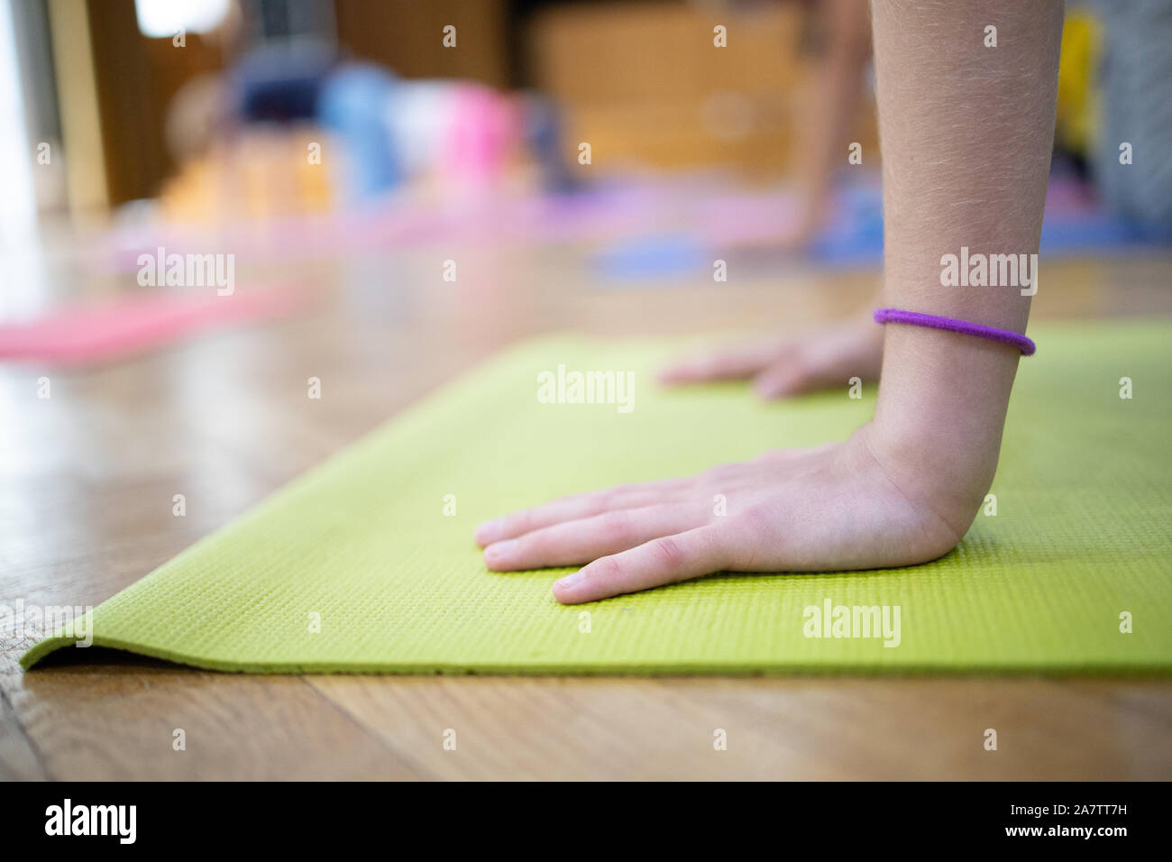 yoga class, yoga training,child , yoga on mats,hands Stock Photo