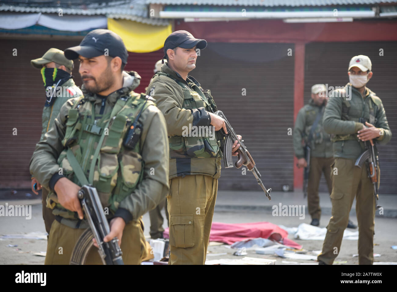 Indian forces stands alert near site of Grenade blast in Srinagar.A non-local resident was killed while and at least 40 people including three security forces personnel were injured in a grenade attack at Gonikhan area of Hari Singh High Street (HSHS) in the heart of Srinagar. Stock Photo