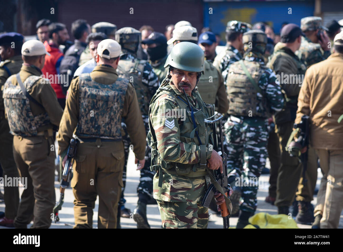 Indian forces stands alert near site of Grenade blast in Srinagar.A non-local resident was killed while and at least 40 people including three security forces personnel were injured in a grenade attack at Gonikhan area of Hari Singh High Street (HSHS) in the heart of Srinagar. Stock Photo