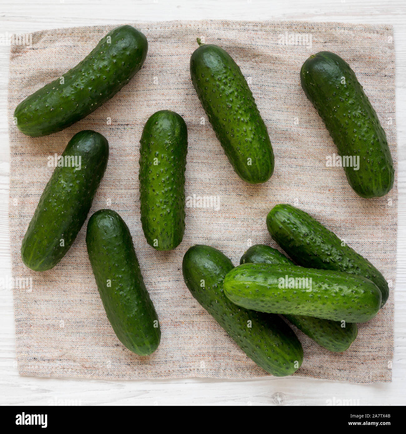 Fresh organic mini baby cucumbers on cloth, view from above. Flat lay, top  view, overhead Stock Photo - Alamy