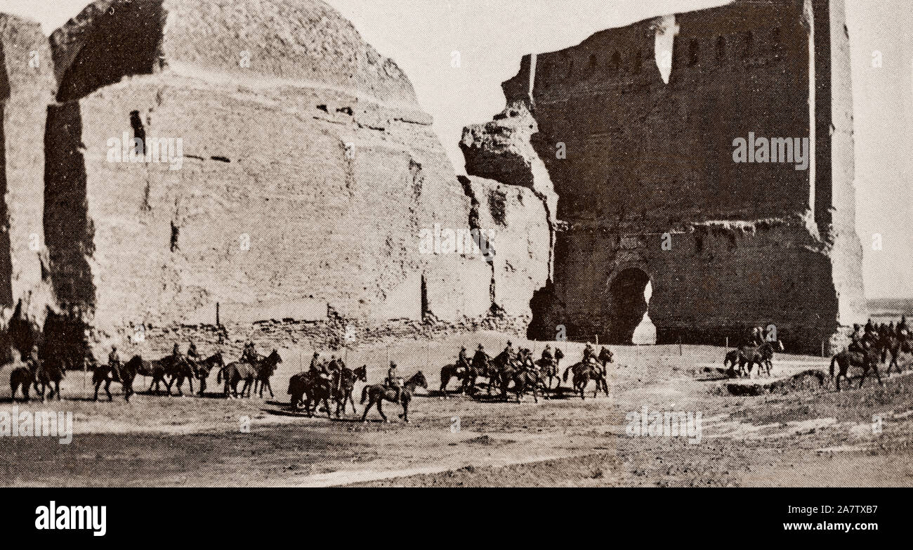 British soldiers pass the Ctesiphon Arch, part of an ancient city, located on the eastern bank of the Tigris, and about 35 kilometres (22 mi) southeast of present-day Baghdad. The ruins became the site of a major battle of World War I in November 1915 when the Ottoman Empire defeated the British troops led by General Townshend whilst attempting to capture Baghdad. The Ottomans drove them back some 40 miles (64 km) before trapping the British force and compelling it to surrender. Stock Photo