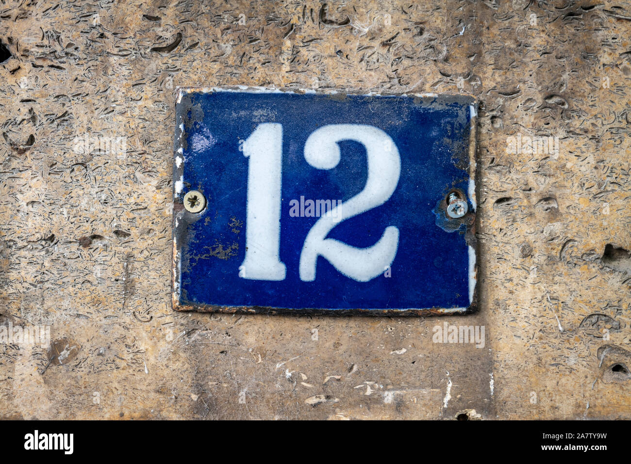 Street number sign on the wall Stock Photo Alamy