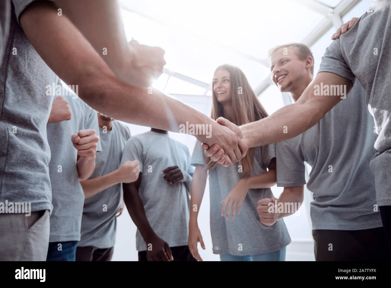 handshake of young people in a circle of friends Stock Photo - Alamy