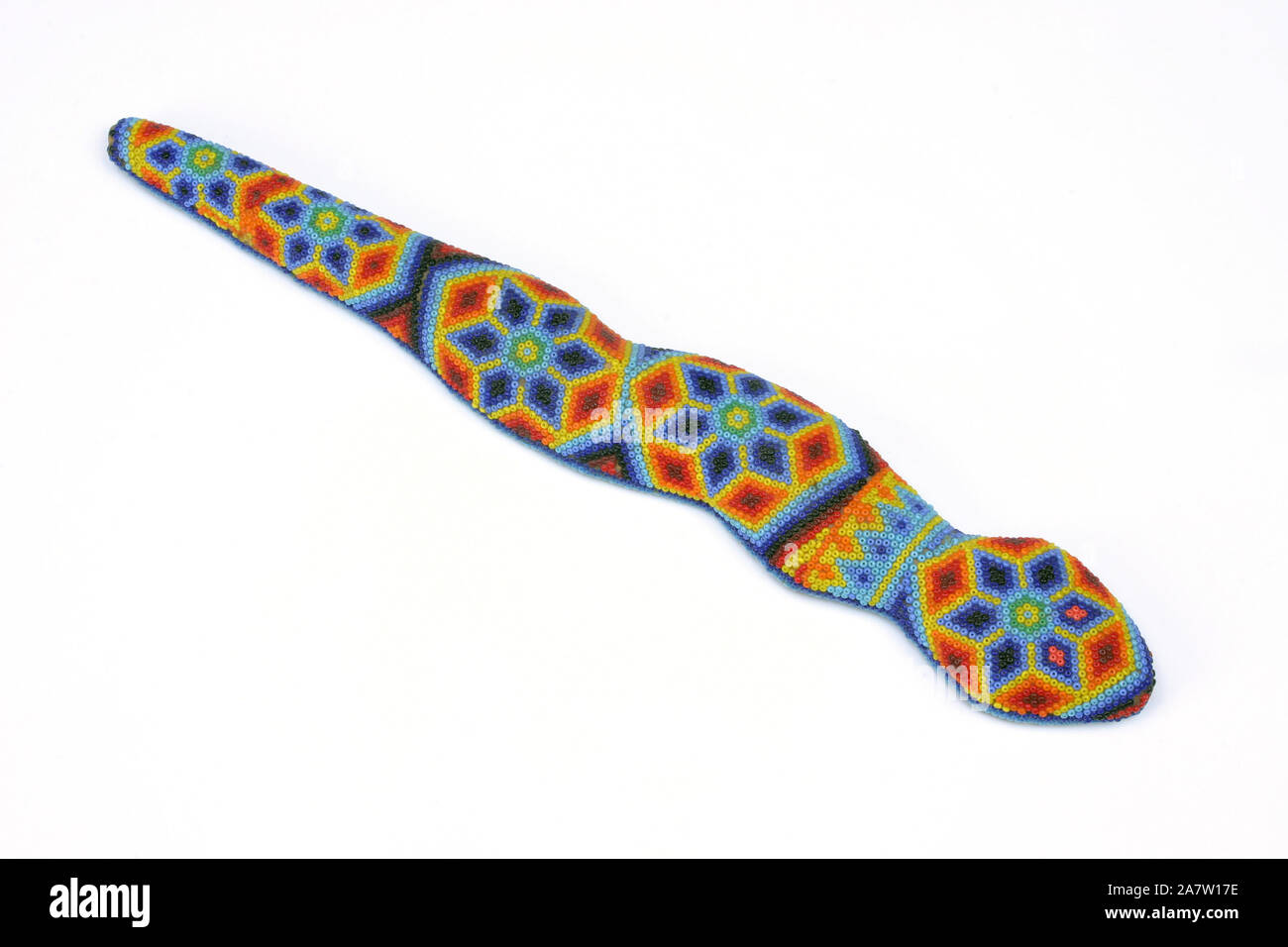 A beaded snake crafted by the Huichol indigenous peoples of Northern Mexico.  Serpents in the Huichol culture are responsible for bringing rain Stock Photo