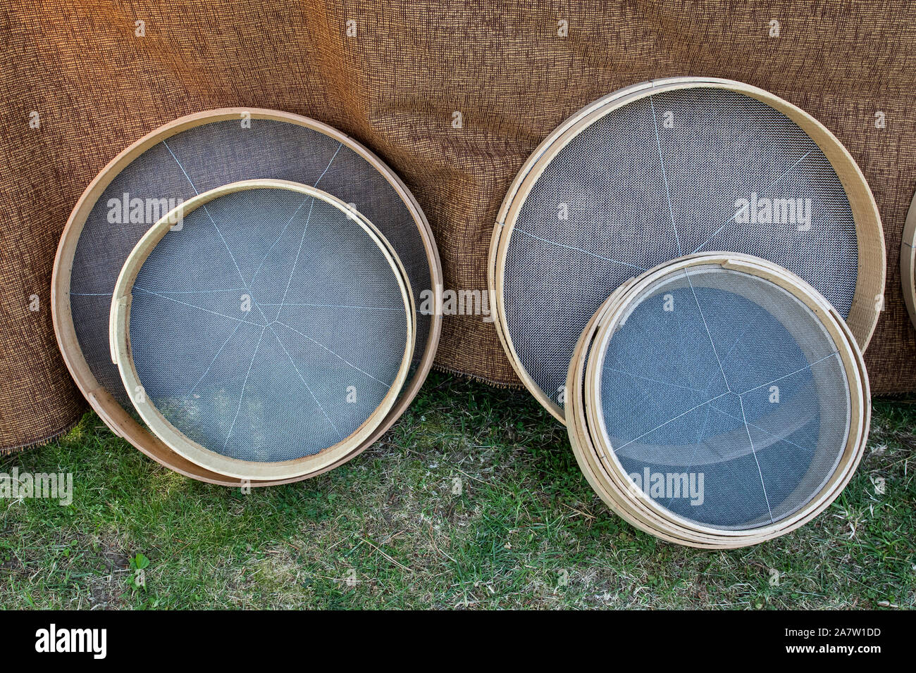 round handmade sieve of different sizes Stock Photo