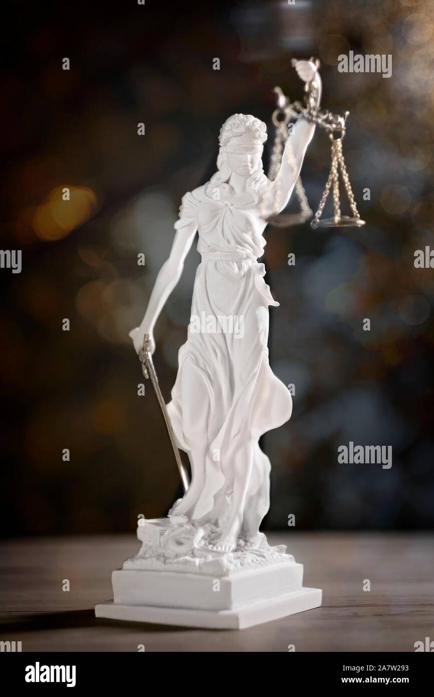Statue of Lady Justice. Vertical image with soft focus and bokeh background. Stock Photo