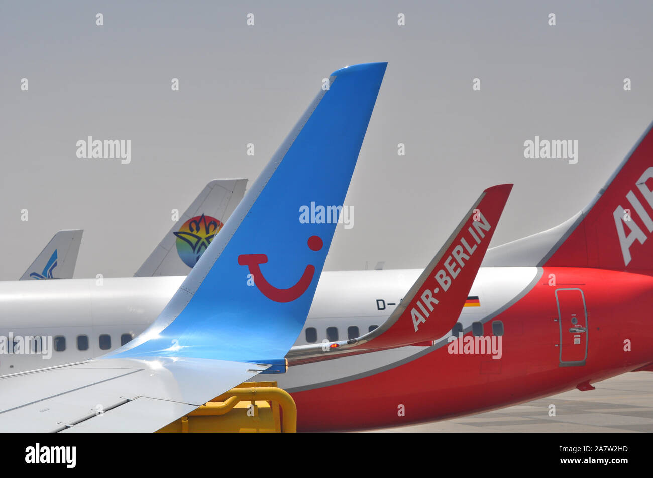 Close up of various tail fins of airliners including Tui and Air Berlin. Stock Photo