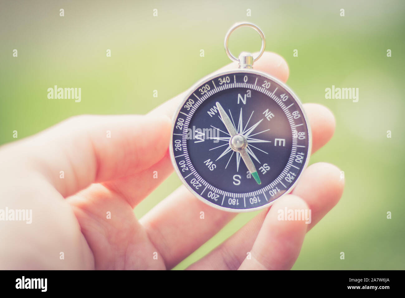 Vintage compass in man’s hand, adventure and discovery concept Stock ...