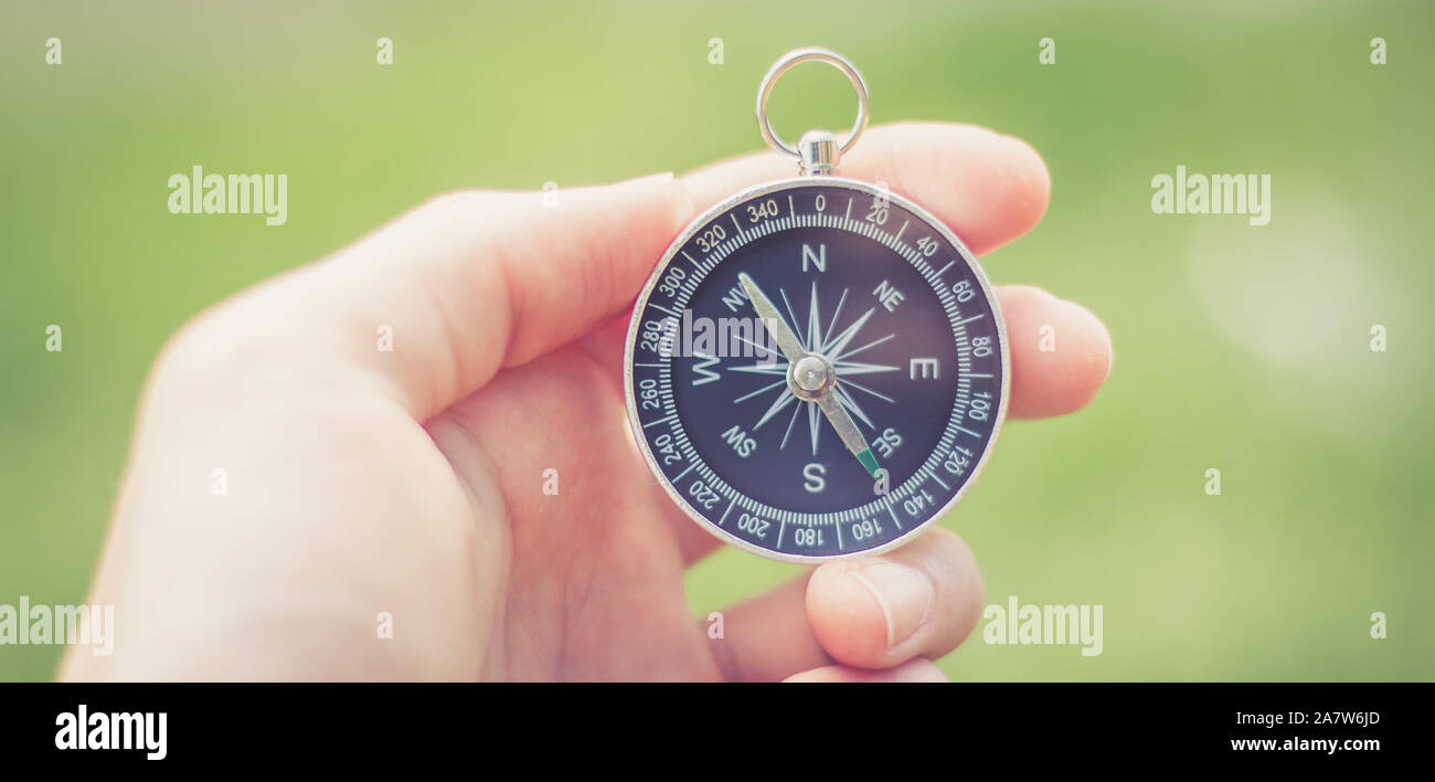Vintage compass in man’s hand, adventure and discovery concept Stock ...