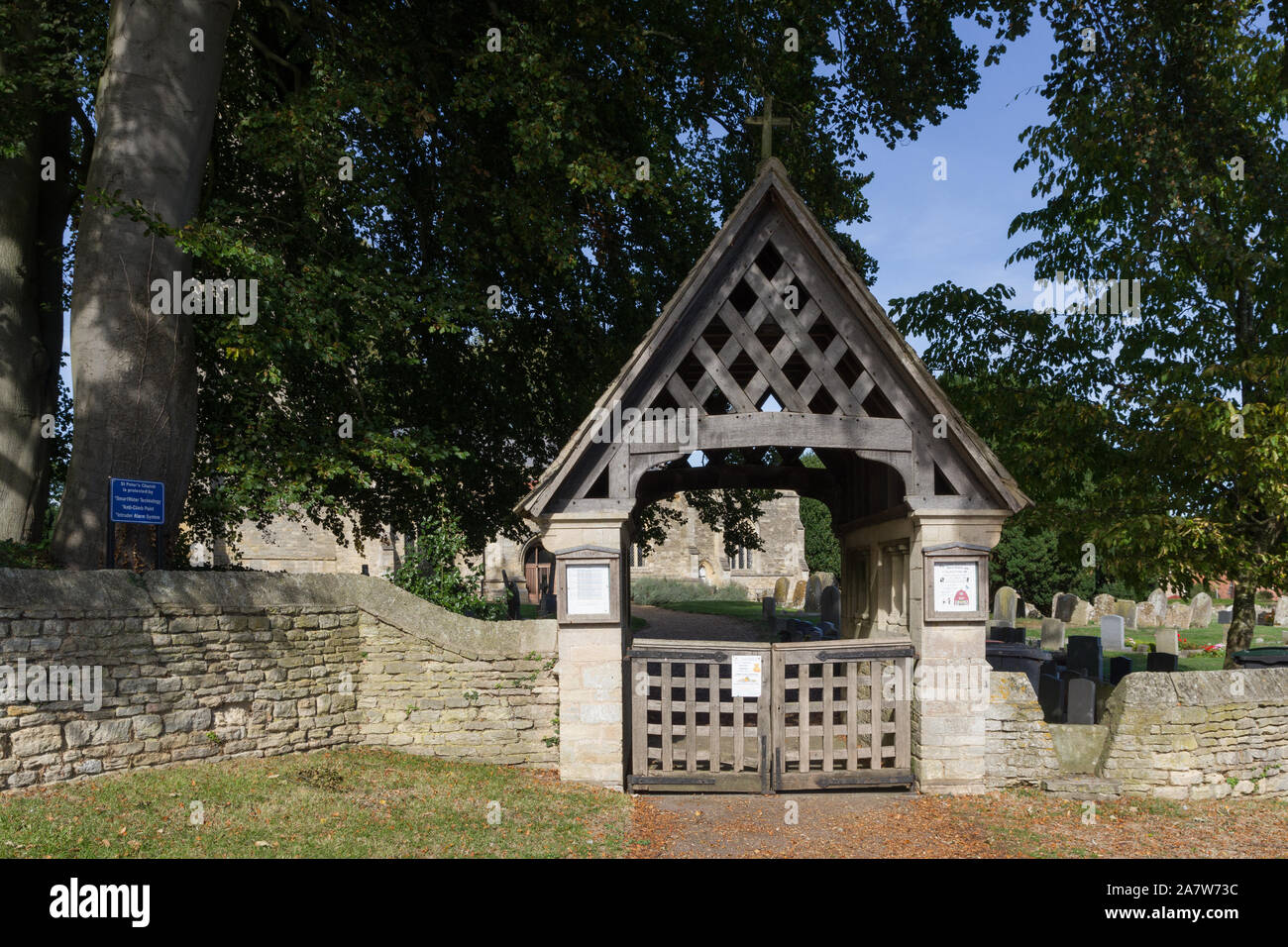 Wooden lych gate to the parish church of St Peter in the village of Sharnbrook, Bedfordshire, UK; Stock Photo
