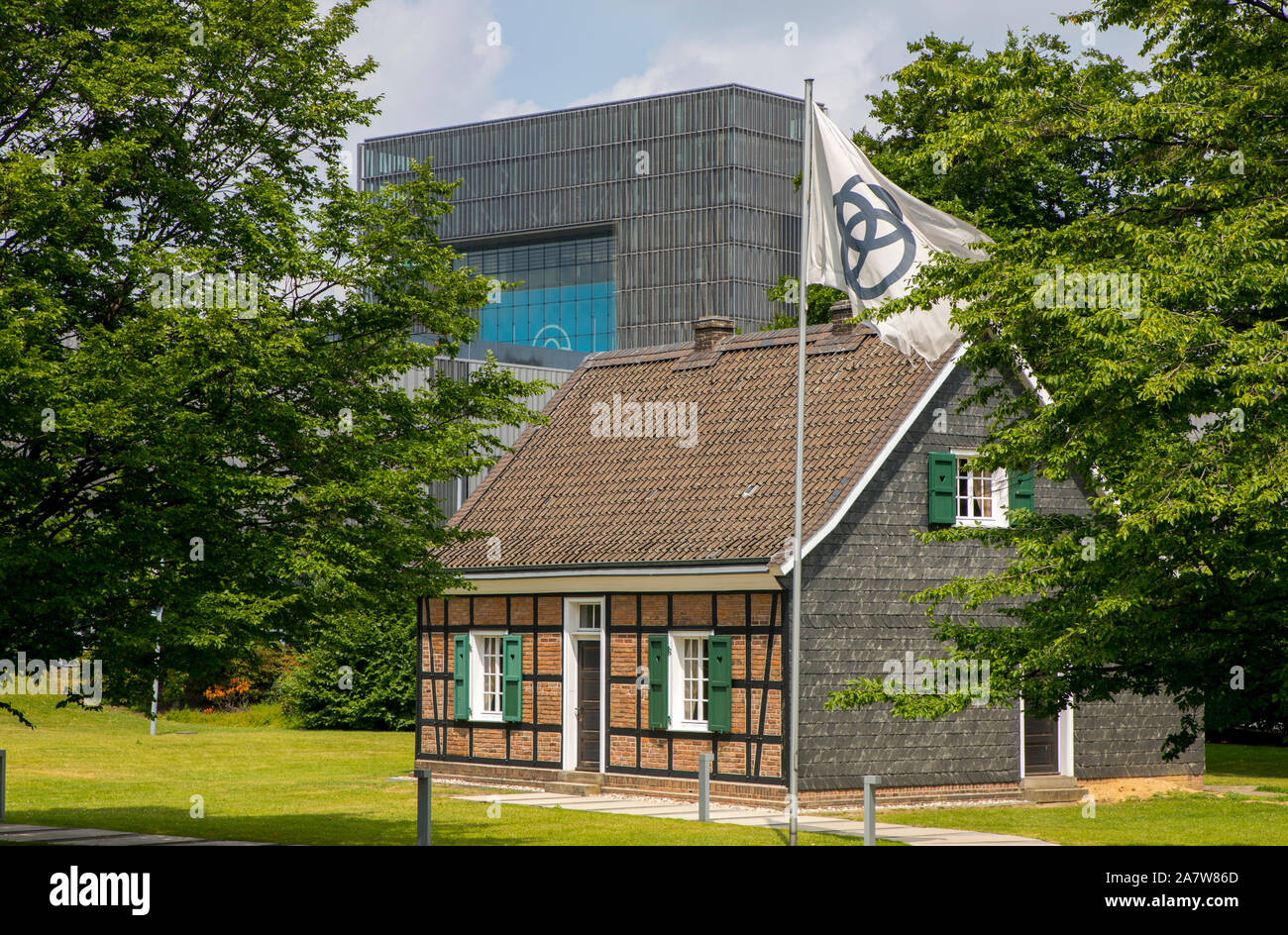 Headquarters Krupp, slate half-timbered building, replica, residence of the Essen industrial family Krupp from 1824 to 1861, behind it the new Thyssen Stock Photo