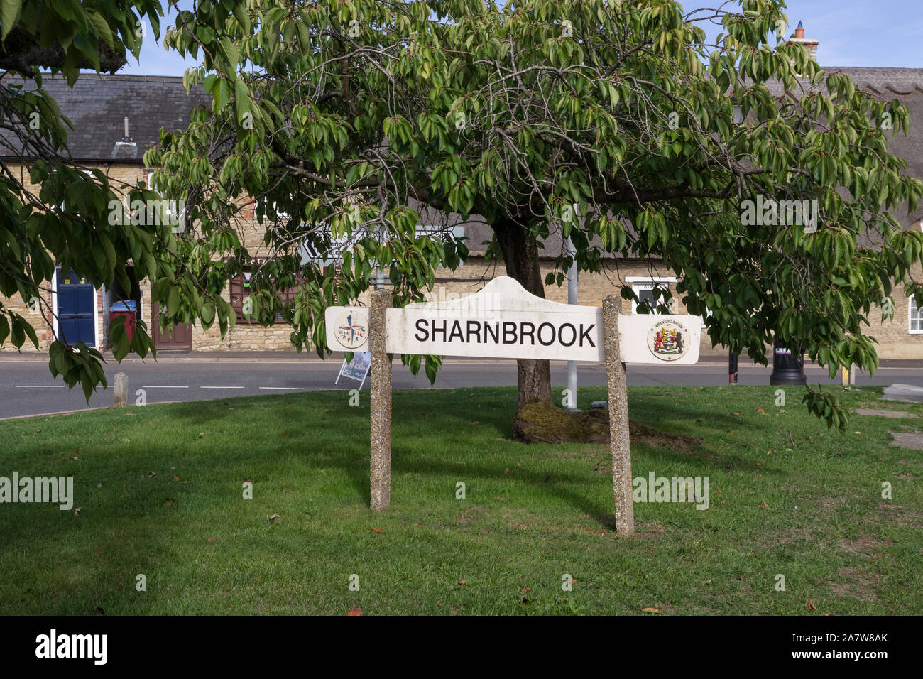 Village sign on the green at Sharnbrook, Bedfordshire, UK Stock Photo