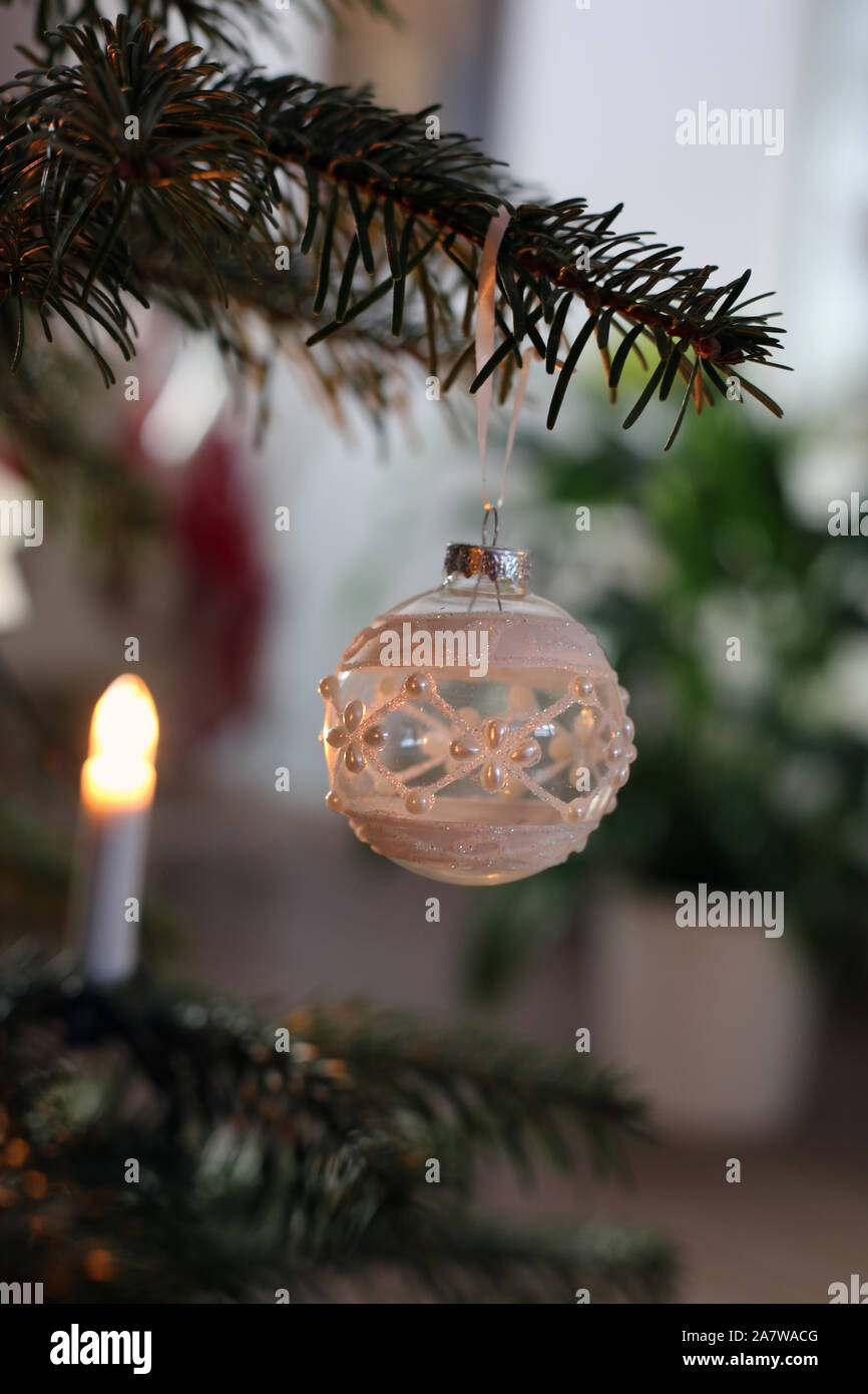 Christmas Ornaments Hanging From A Christmas Tree Branch