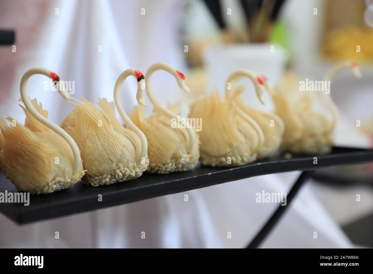 The desserts featuring the shape of swans are displayed during the 7th