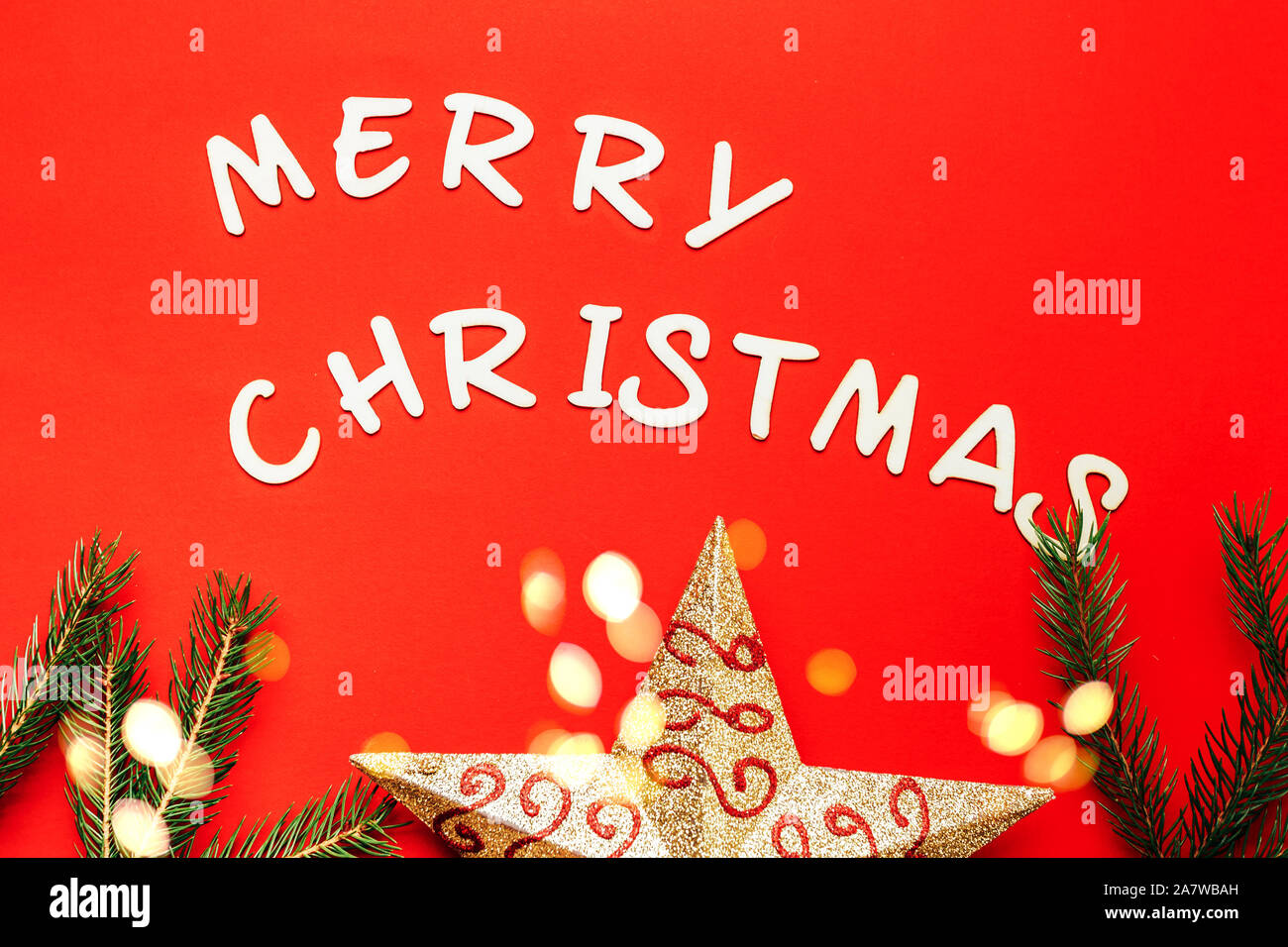 words of Merry christmas on red background. Stock Photo