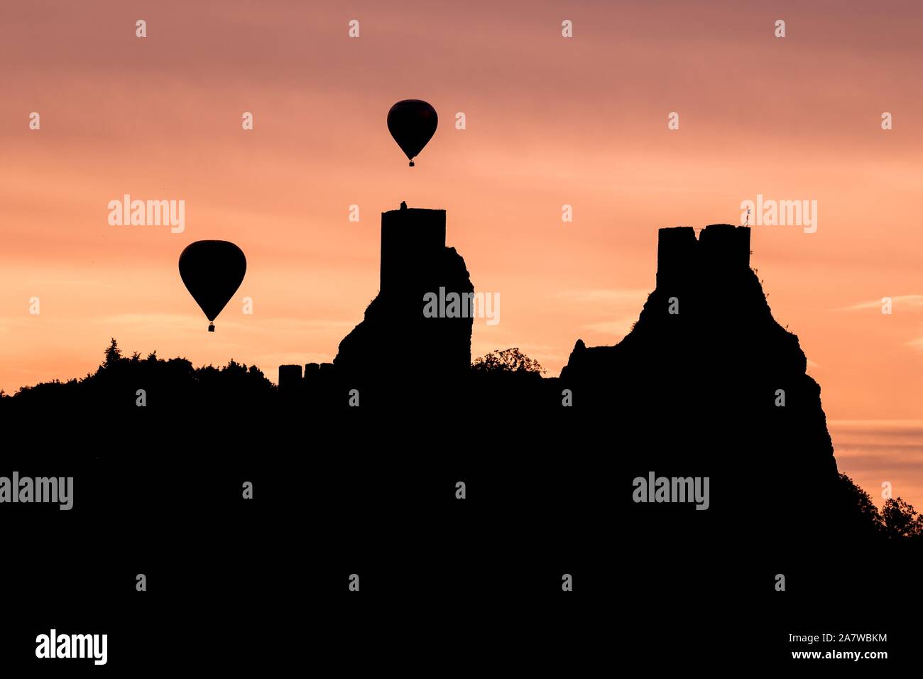 The ruins of Trosky Castle in the Bohemian Paradise area with hot air balloons Stock Photo