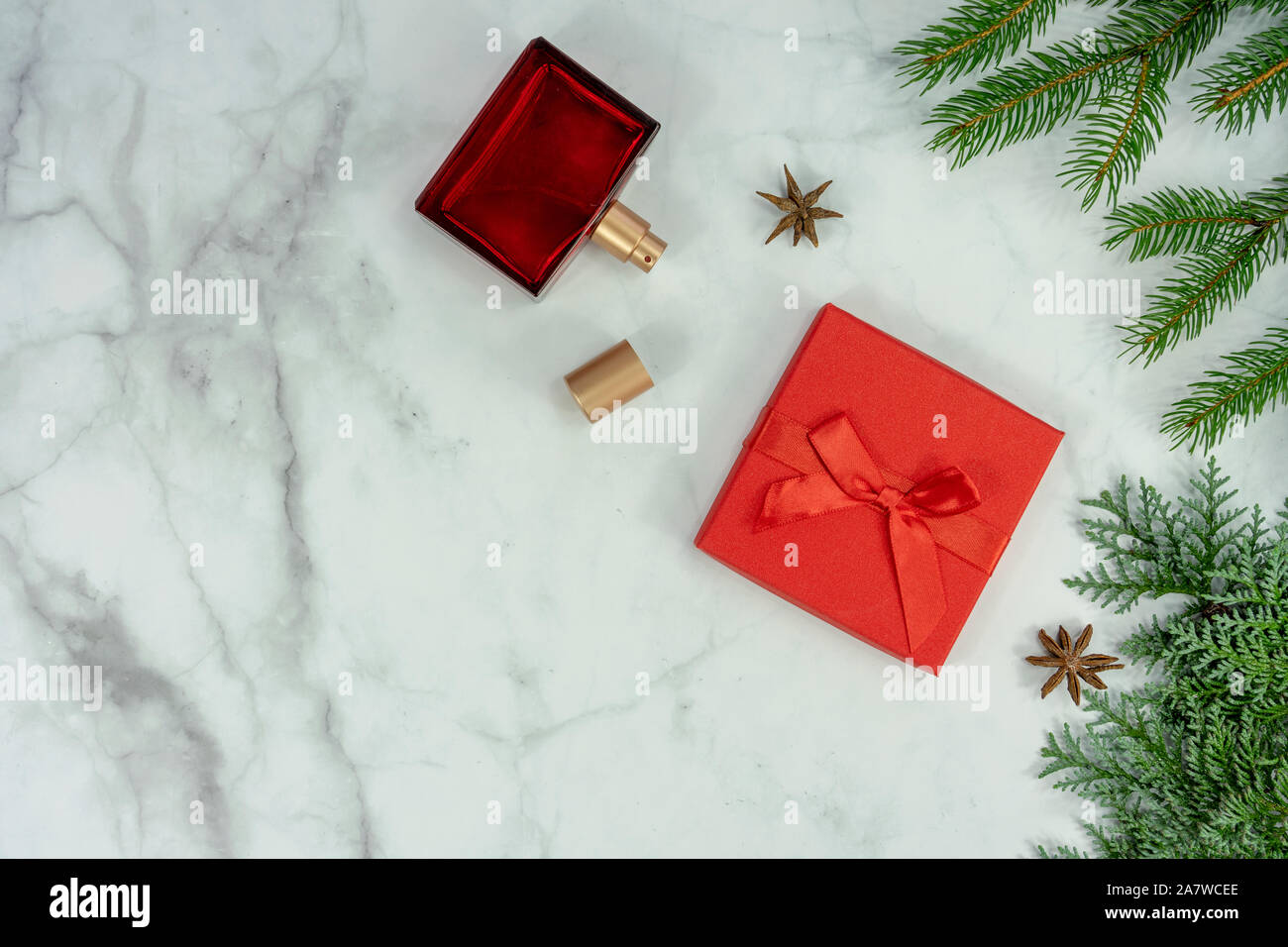 Christmas frame background flat lay on marbel with decoration gift box and perfume . Stock Photo